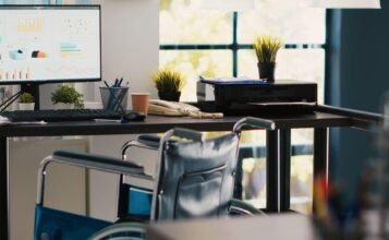 Employee with workplace disability accommodation with accessible office setup