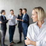 Employee experiencing workplace discrimination after being excluded from a corporate meeting