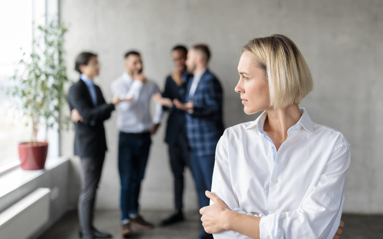 Employee experiencing workplace discrimination after being excluded from a corporate meeting